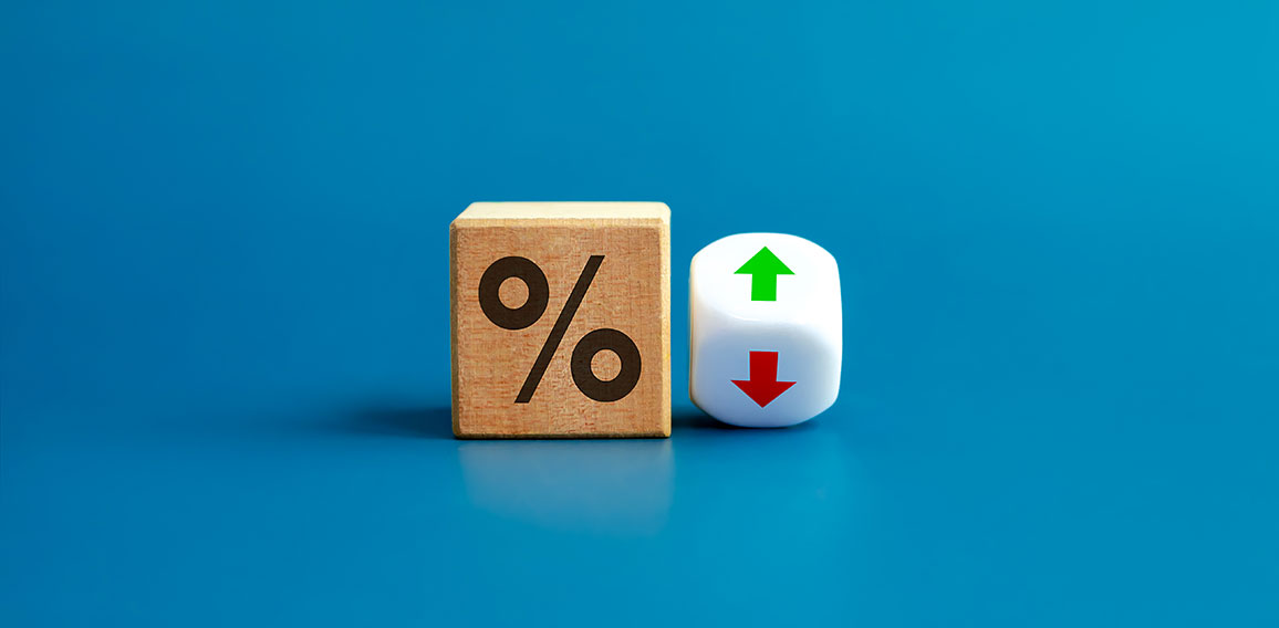 Percentage icon on wooden cube block and up and down arrow symbo