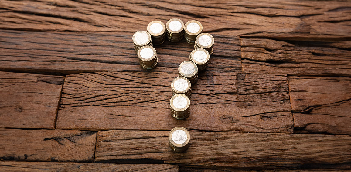 Stacked Coins Forming Question Mark