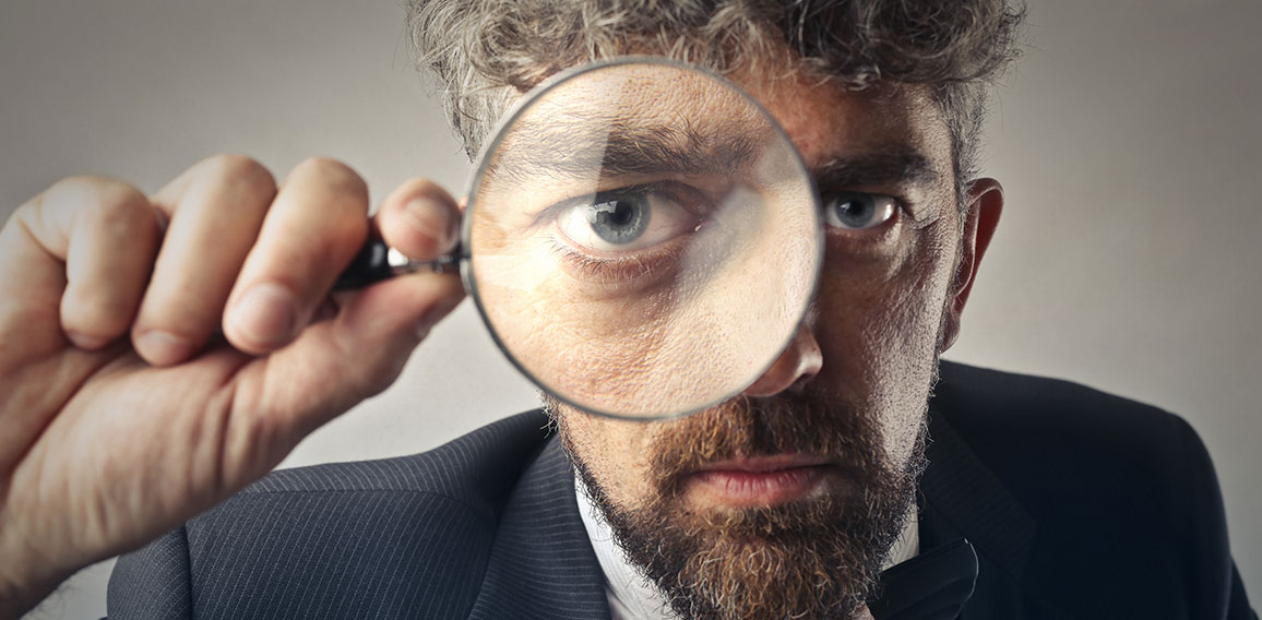 Man using a magnifier