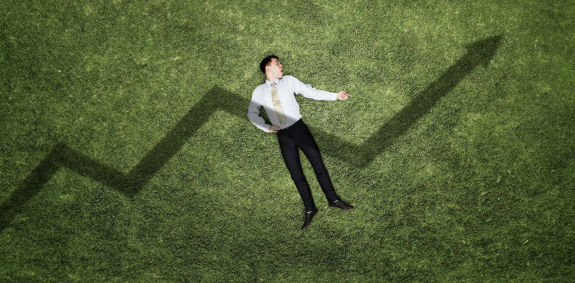 Businessman on green grass