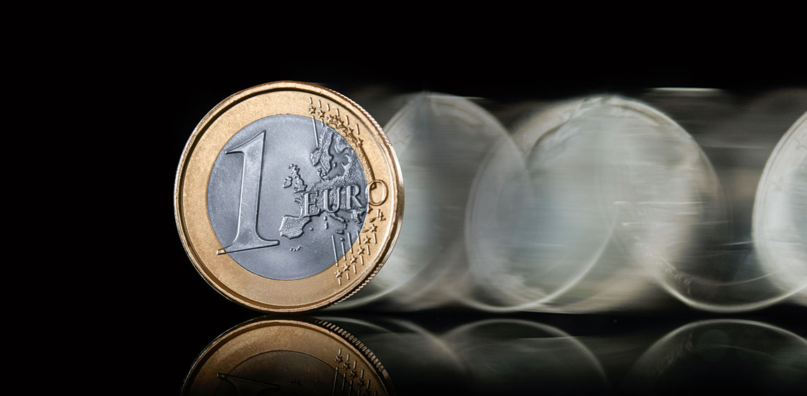 euro coin spin on dark background