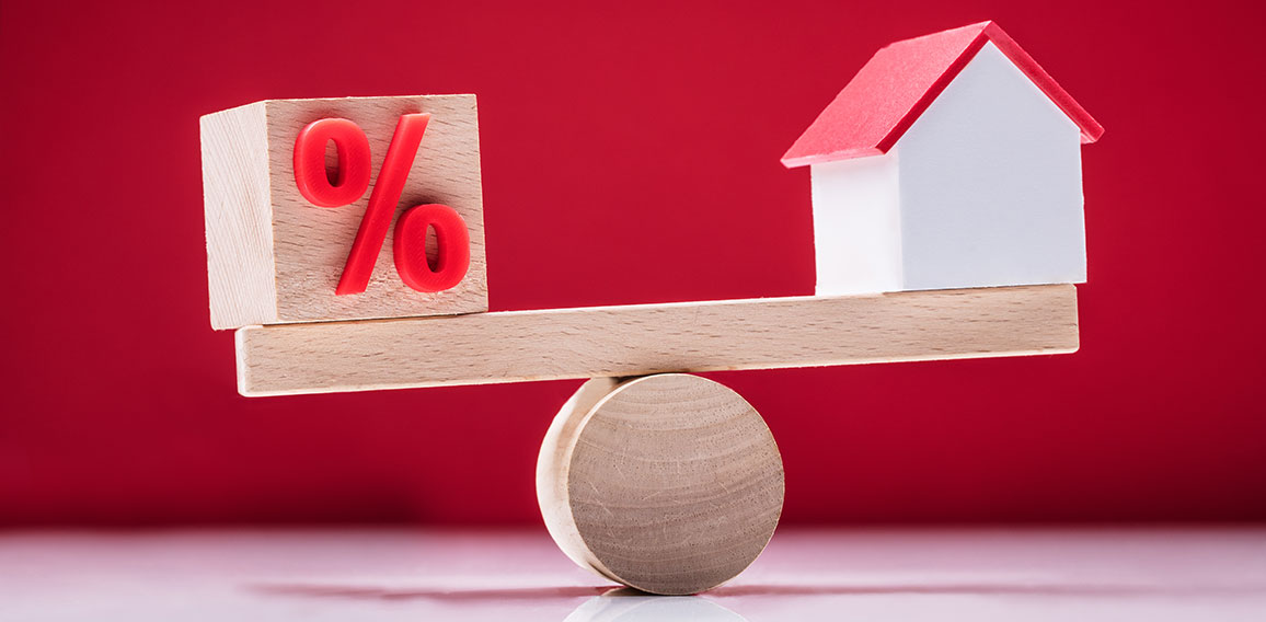 Seesaw Showing Balance Between Percentage Symbol And House Model