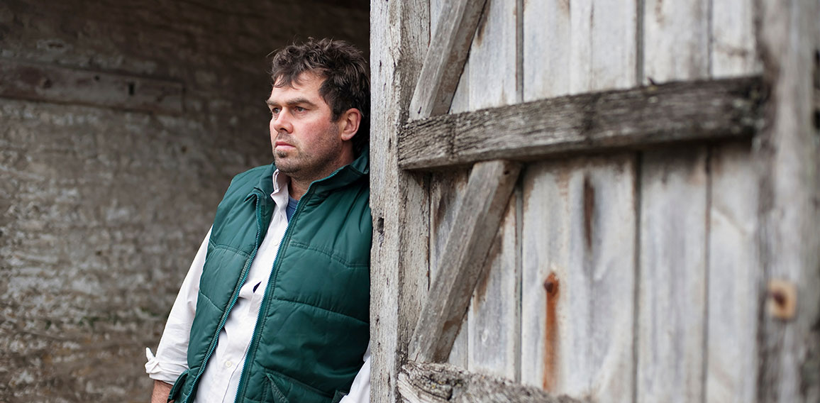 farmer standing in barn