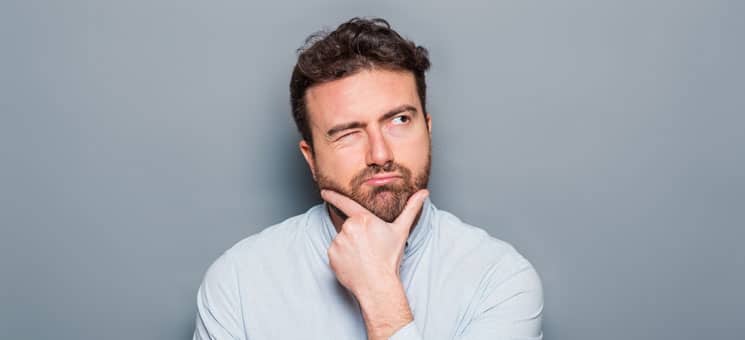 One man portrait isolated on gray background