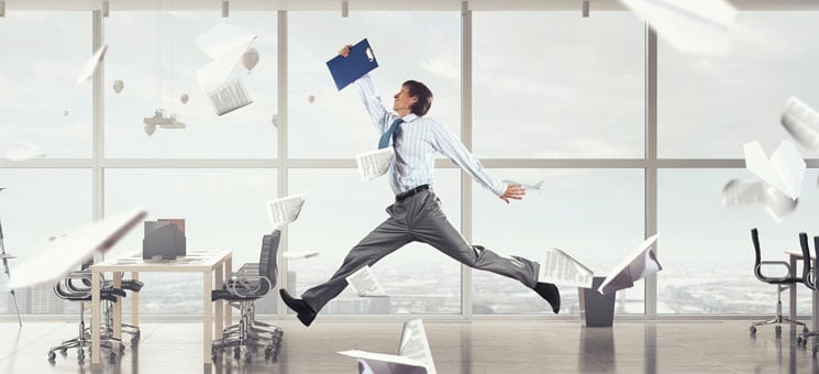 Jumping businessman in office . Mixed media