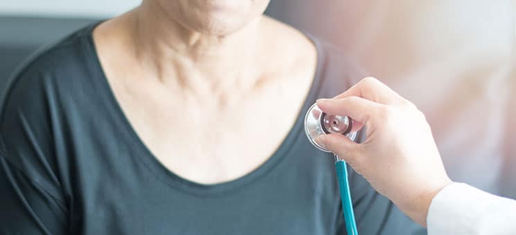 Doctor hand with stethoscope check up elderly woman people. Old