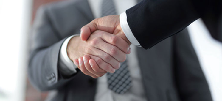 Business men giving a handshake. Business concept