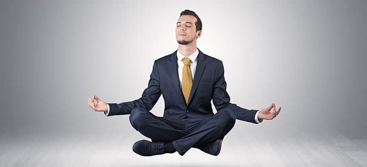 Businessman meditates in an empty space concept