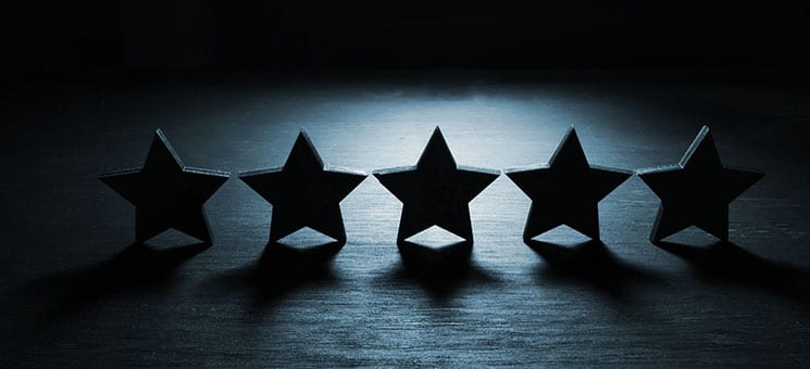 Five stars in the dark. Customer experience and satisfaction concept.