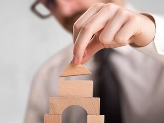 Businessman building a tower