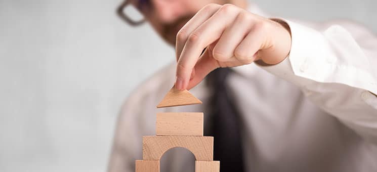 Businessman building a tower