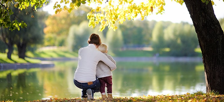 Woman and her toddler son in park