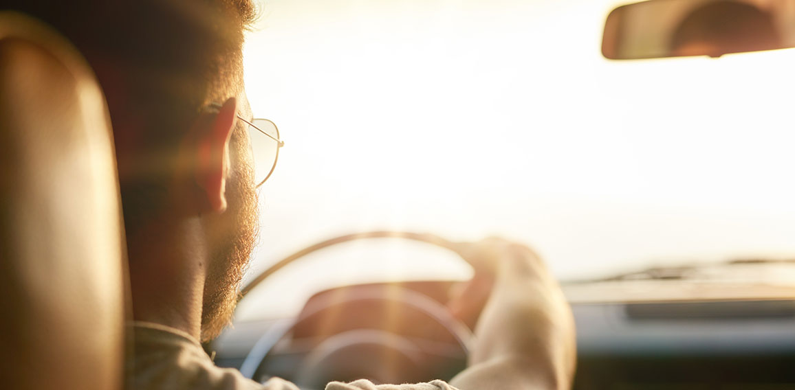 Young man driving his car