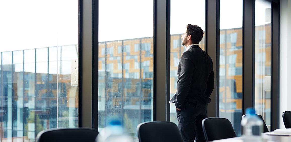 Successful Businessman by Window