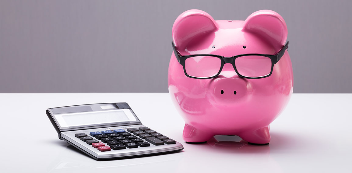 Piggybank With Eyeglasses And Calculator