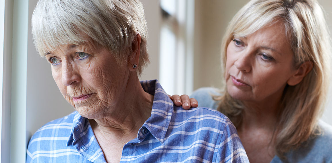 Serious Senior Woman With Adult Daughter At Home