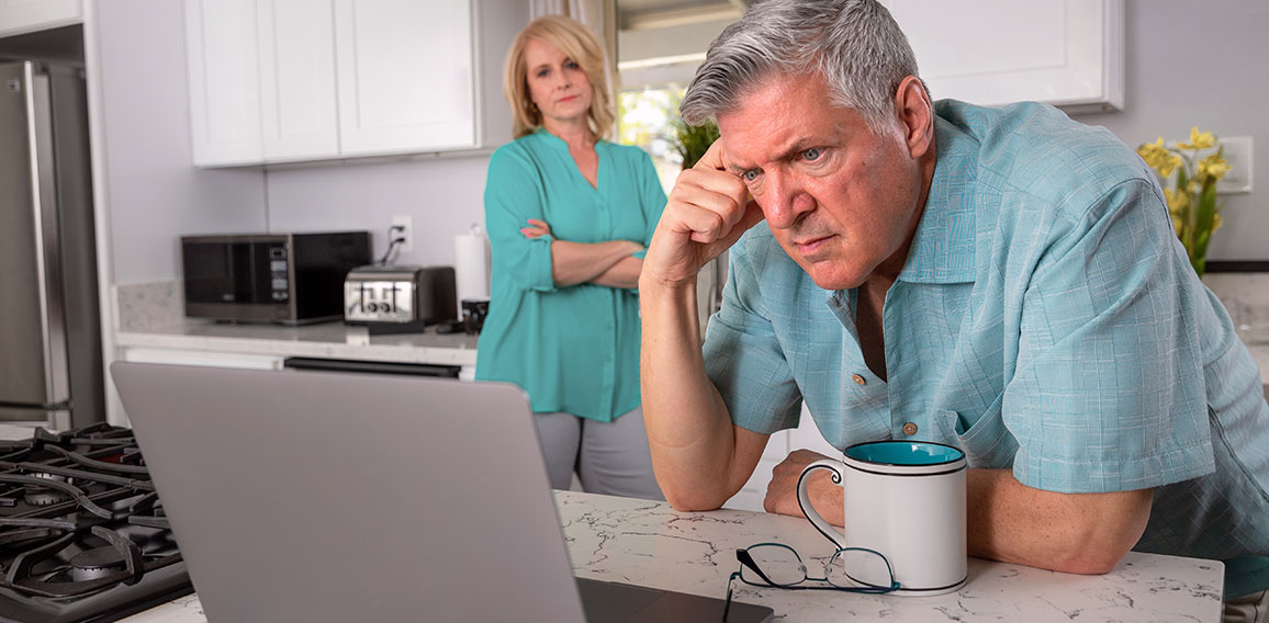 Older senior married couple in distress, concerned over mortgage