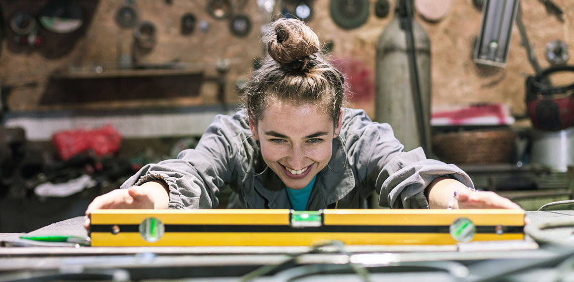 young woman working in a workshop