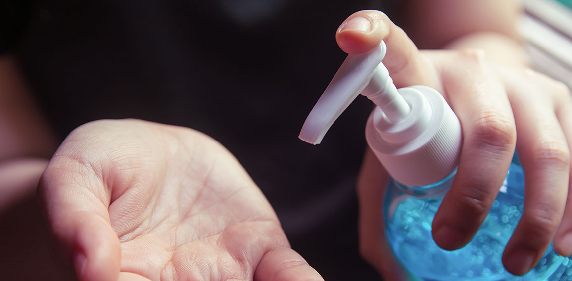 Woman using alcohol gel for cleaning hands prevention of coronav