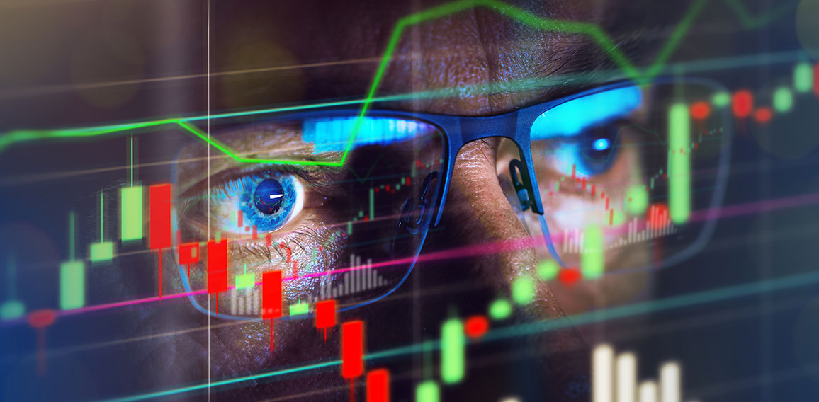 Close up of stock market trader looking at graph