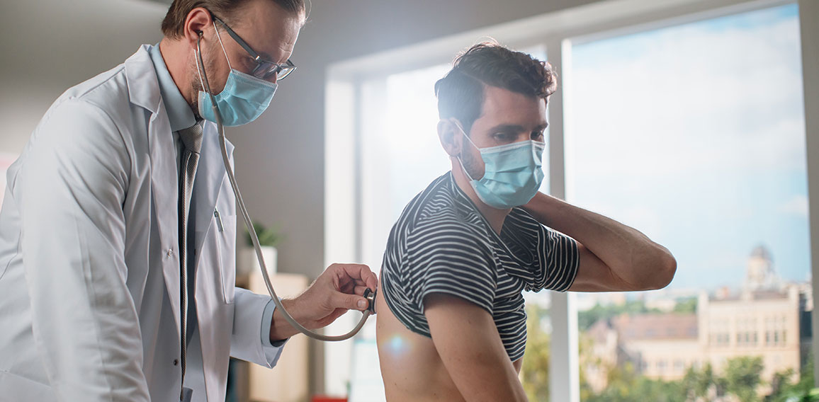 Doctor Consultation Office: Physician Listens to Patient's Lungs