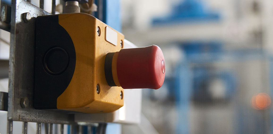 Start or stop button for industrial machine, close-up