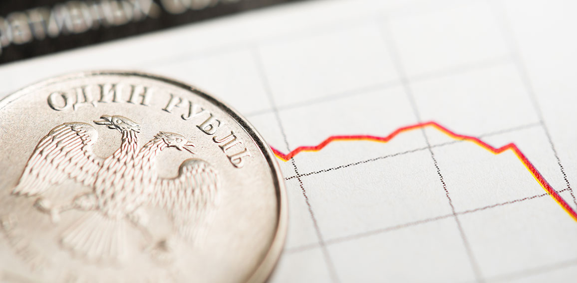 One rouble coin on fluctuating graph. Rate of the Russian rouble