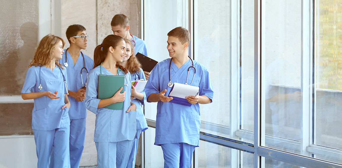 Young students in hall of university indoors