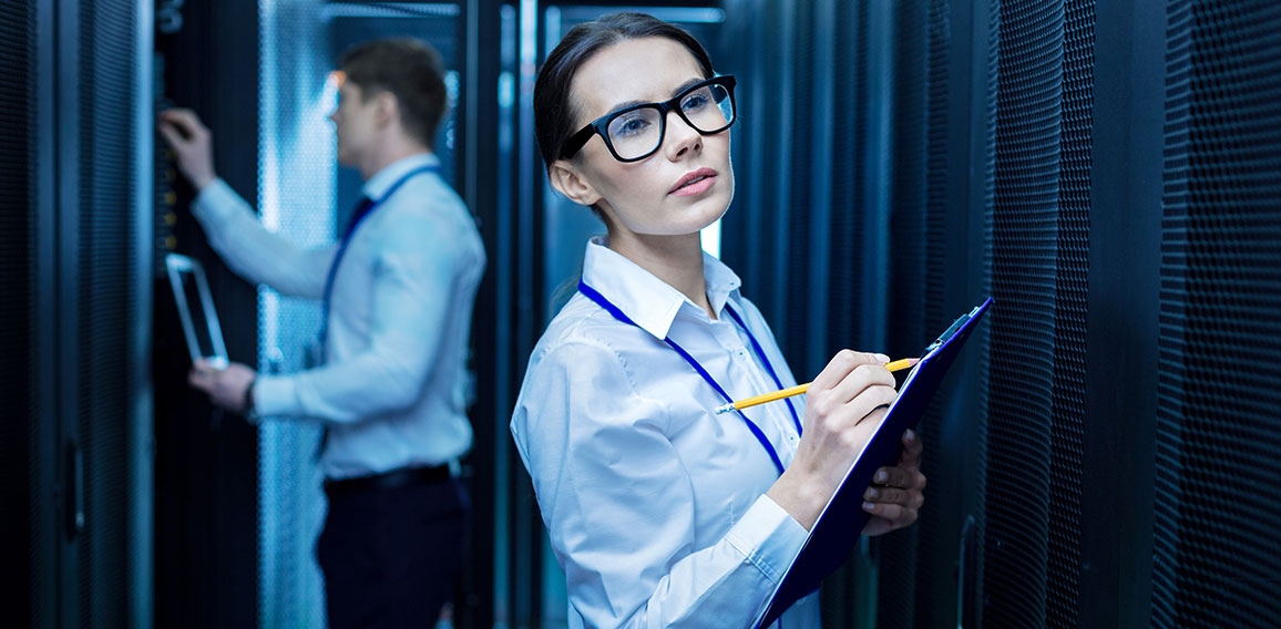 Serious colleagues working in the data center