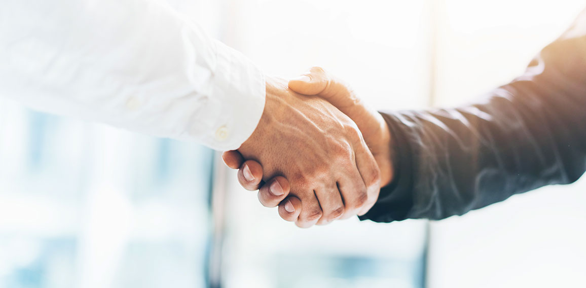 Business partnership meeting. Picture businessmans handshake. Successful businessmen handshaking after good deal. Horizontal, blurred background