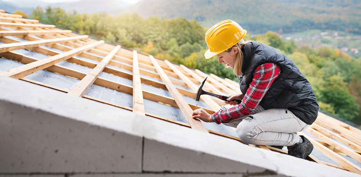 Young woman worker on the construction site.