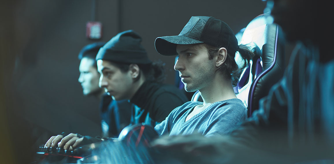 Serious man in cap working in database center