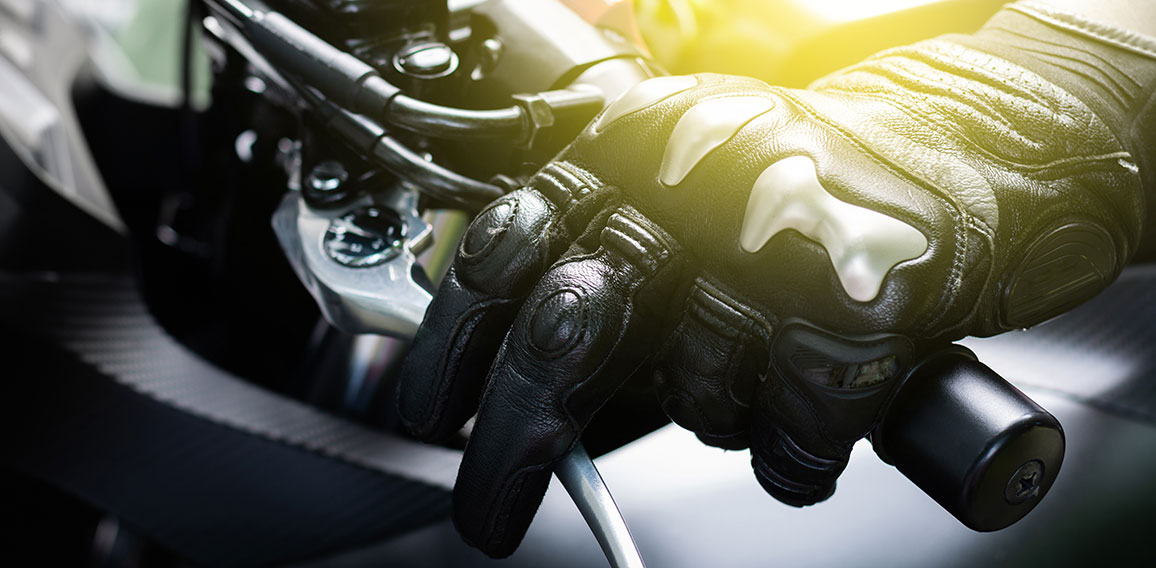 Close up of hand and clutch lever motorcycle, Hands wearing blac