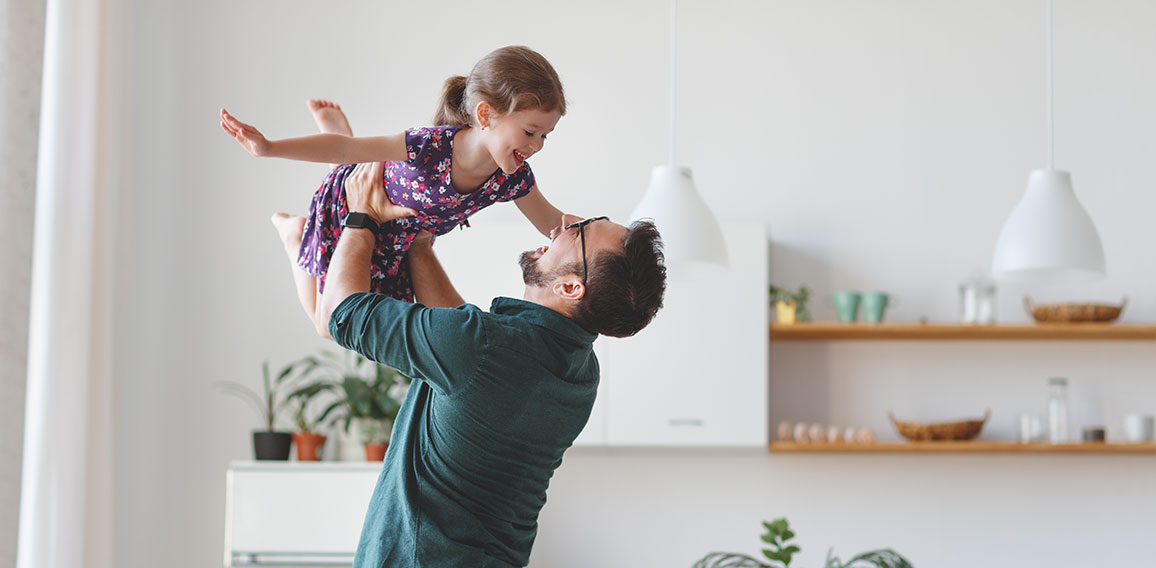 Father's day. Happy family daughter hugs his dad