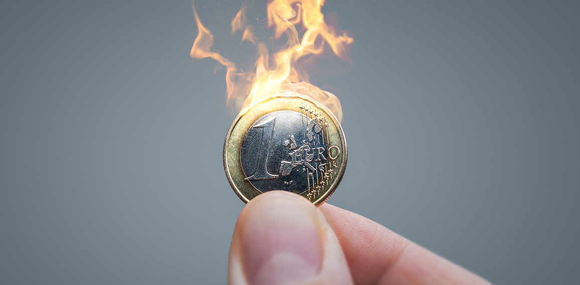 Euro coin on fire