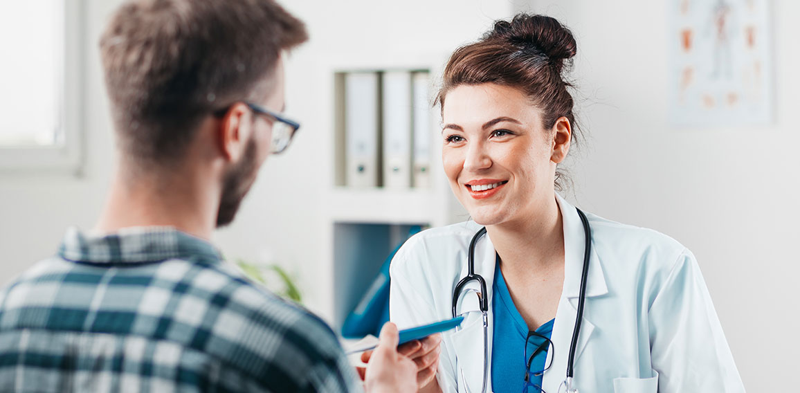 Woman Doctor prescribes medicine to Young Patient