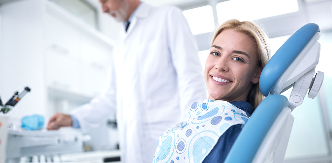 Smiling and happy young woman after successful treatment