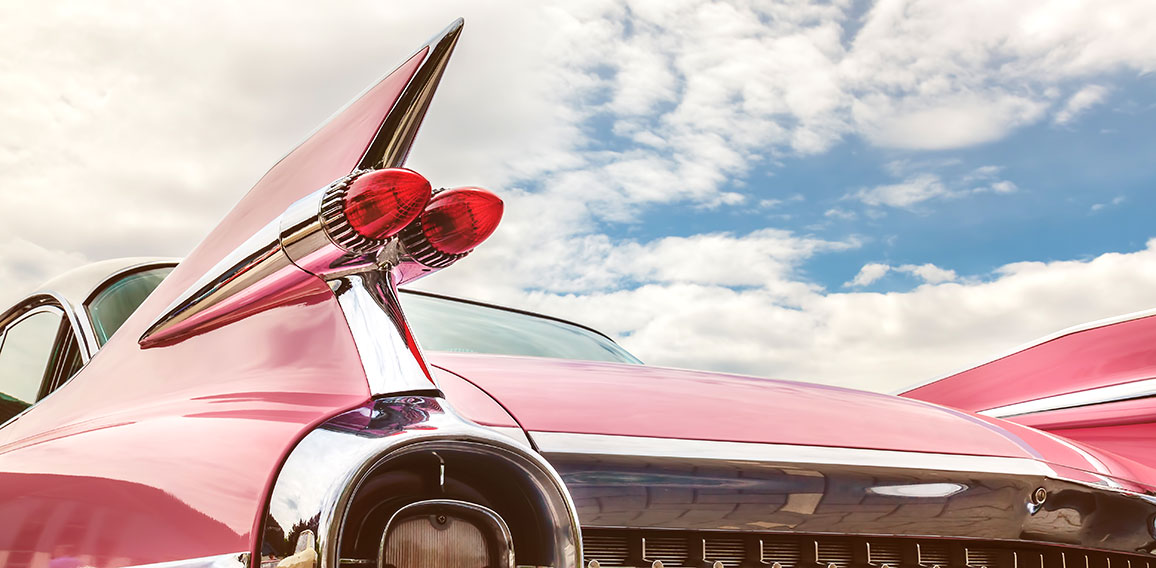 Rear end of a pink classic car