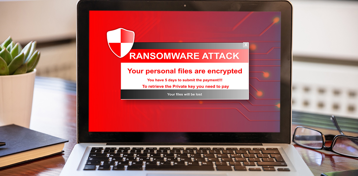 Ransomware attack concept. Ransomware text on a laptop screen