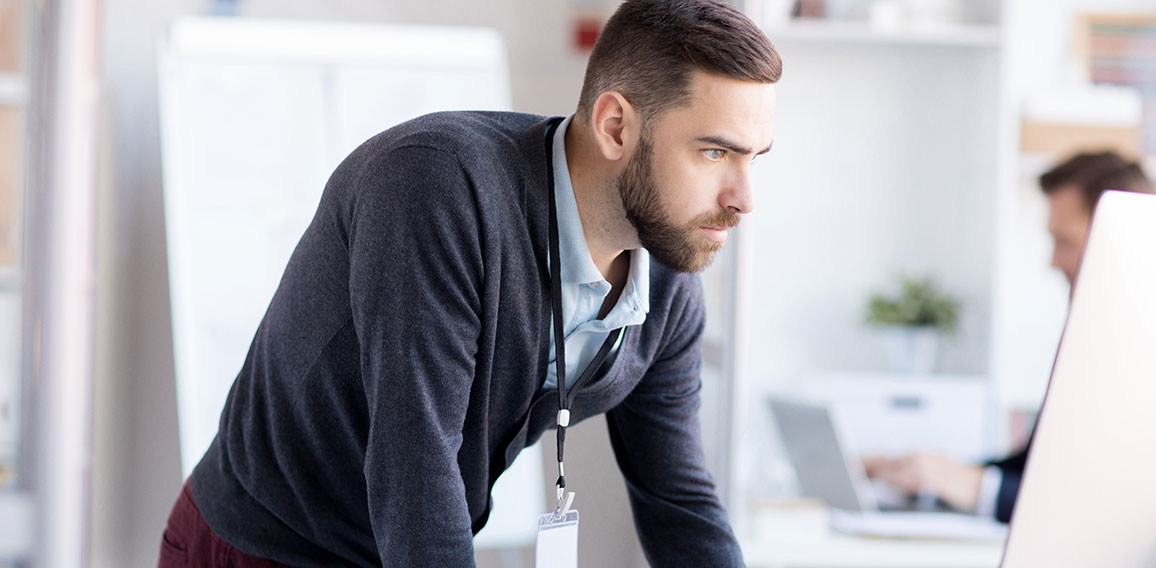 Nervous Businessman using Computer