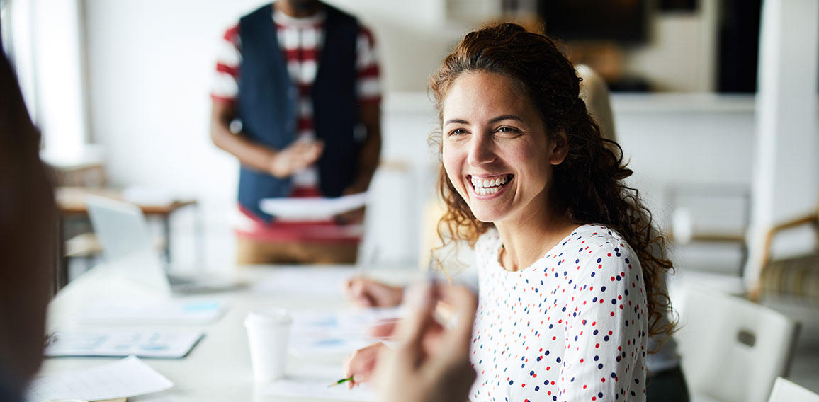 Happy businesswoman at meeting