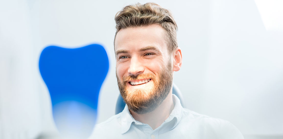 Man with great smile at the dental office