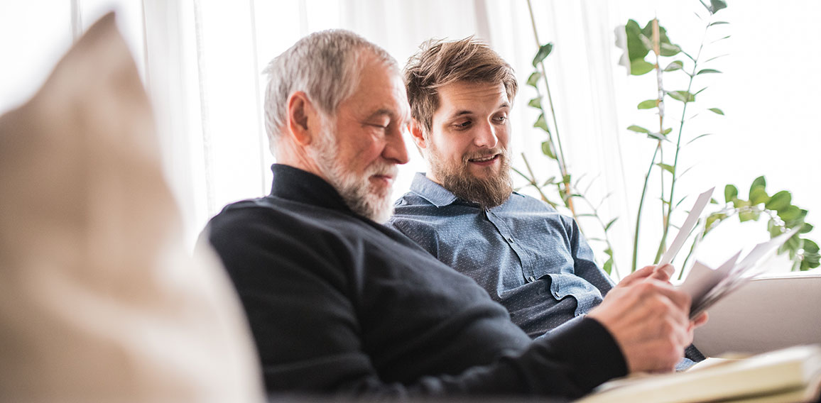 Hipster son and his senior father at home.