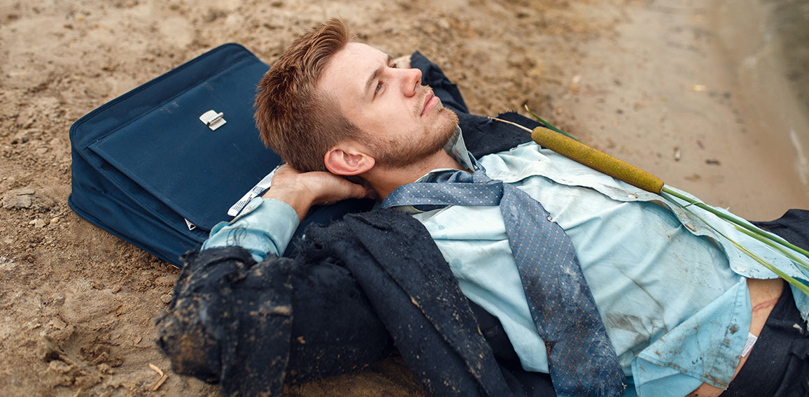 Office worker resting on the beach, desert island