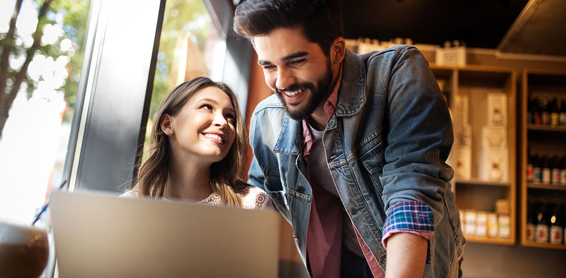 Young couple or college student using laptop computer notebook work together