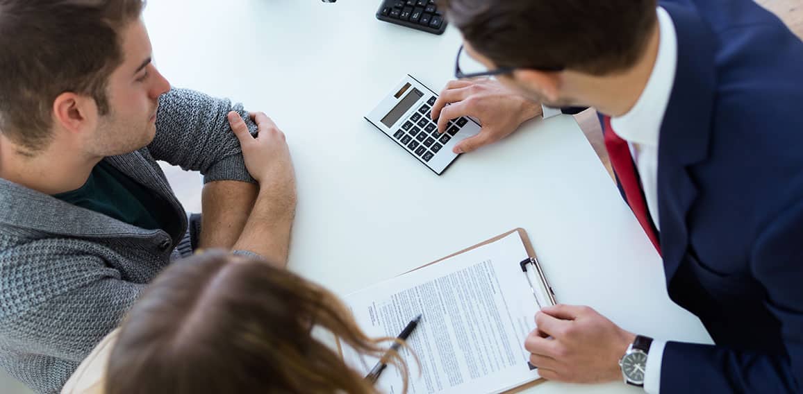 Business man explaining terms of contract to his clients in the