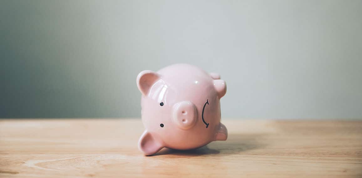 Piggy bank on wood table. Financial investment and save money concept