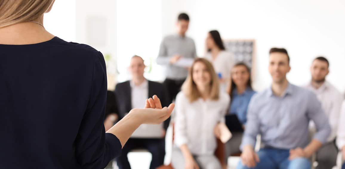 Female business trainer giving lecture in office