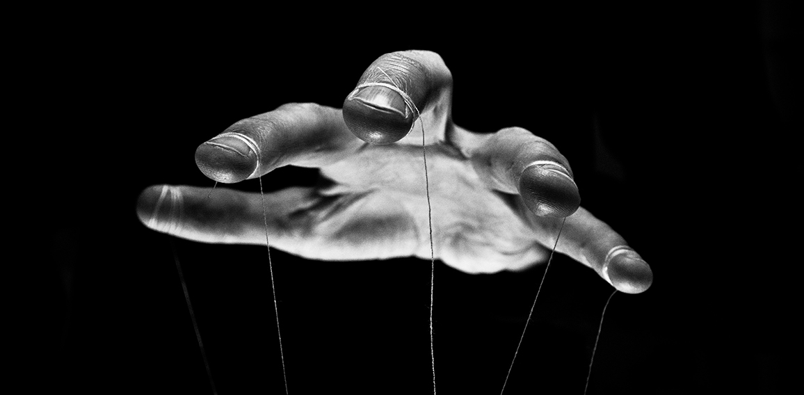 Eerie puppeteer hands controlling you. Manipulation concept