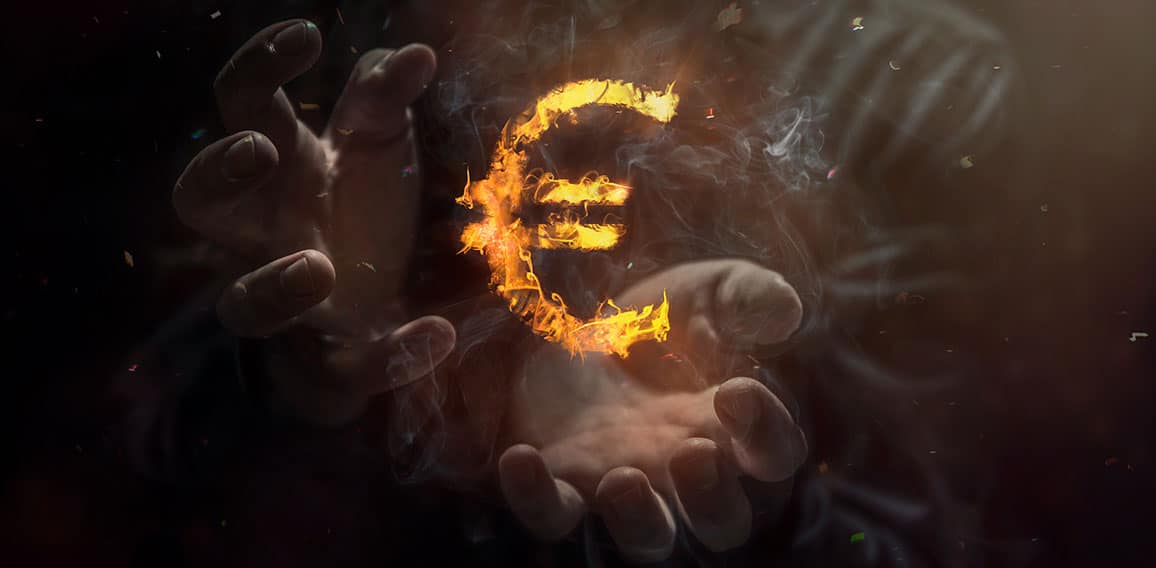 Burning symbol of euro with man in the background. Conception of risk management in money trading at currency market